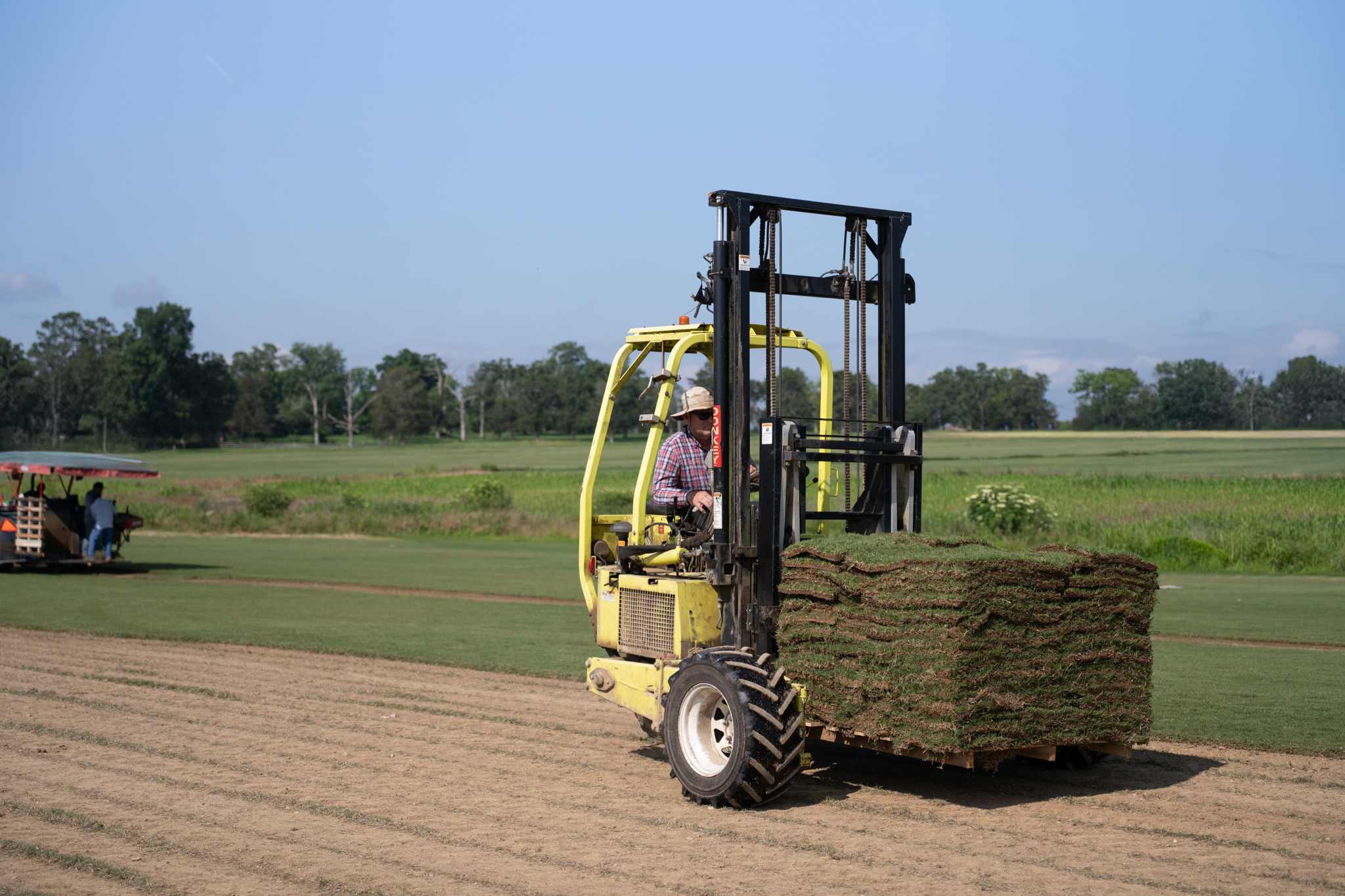 Forklift transporting fresh sod for delivery in Chattanooga and Ringgold.